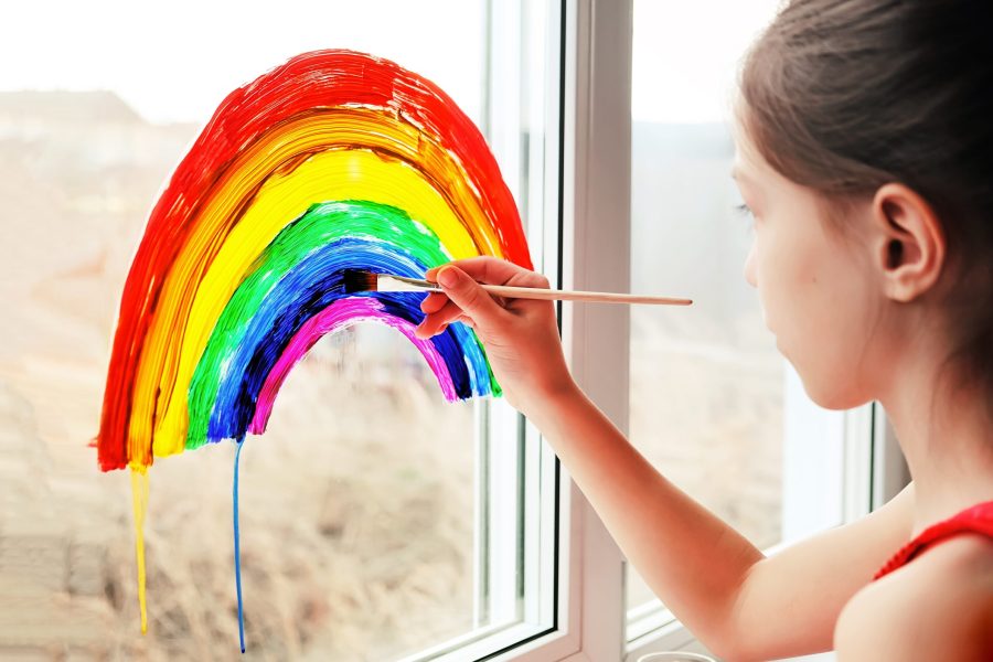 Schoolgirl,Draws,Rainbow,Sign,Of,Hope,On,Window.