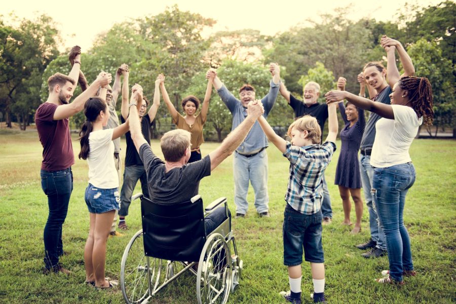 Group,Of,People,Holding,Hand,Together,In,The,Park